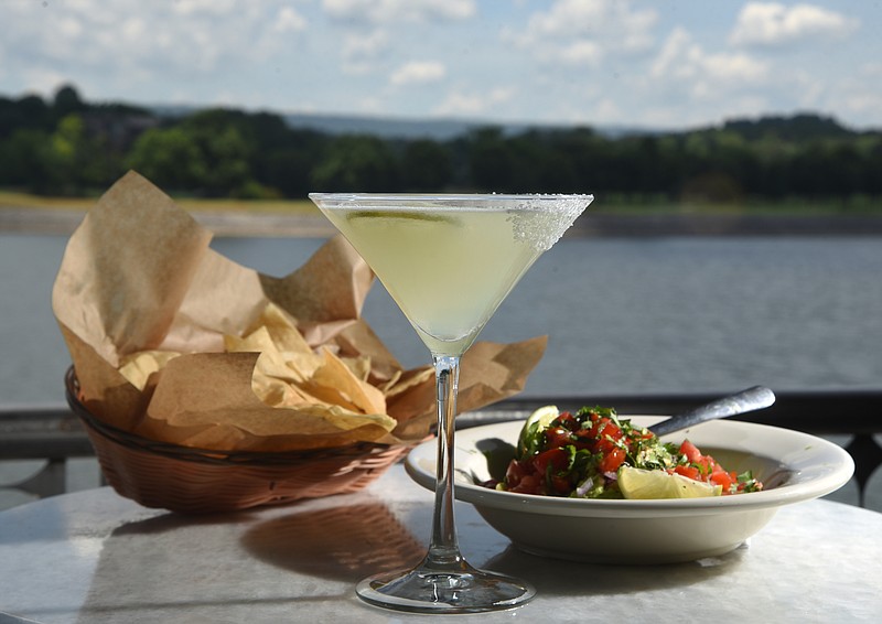 A Lawton's Margarita sits on the table with guacamole and chips Thursday, June 16, 2016 at The Boathouse Rotisserie and Raw Bar.