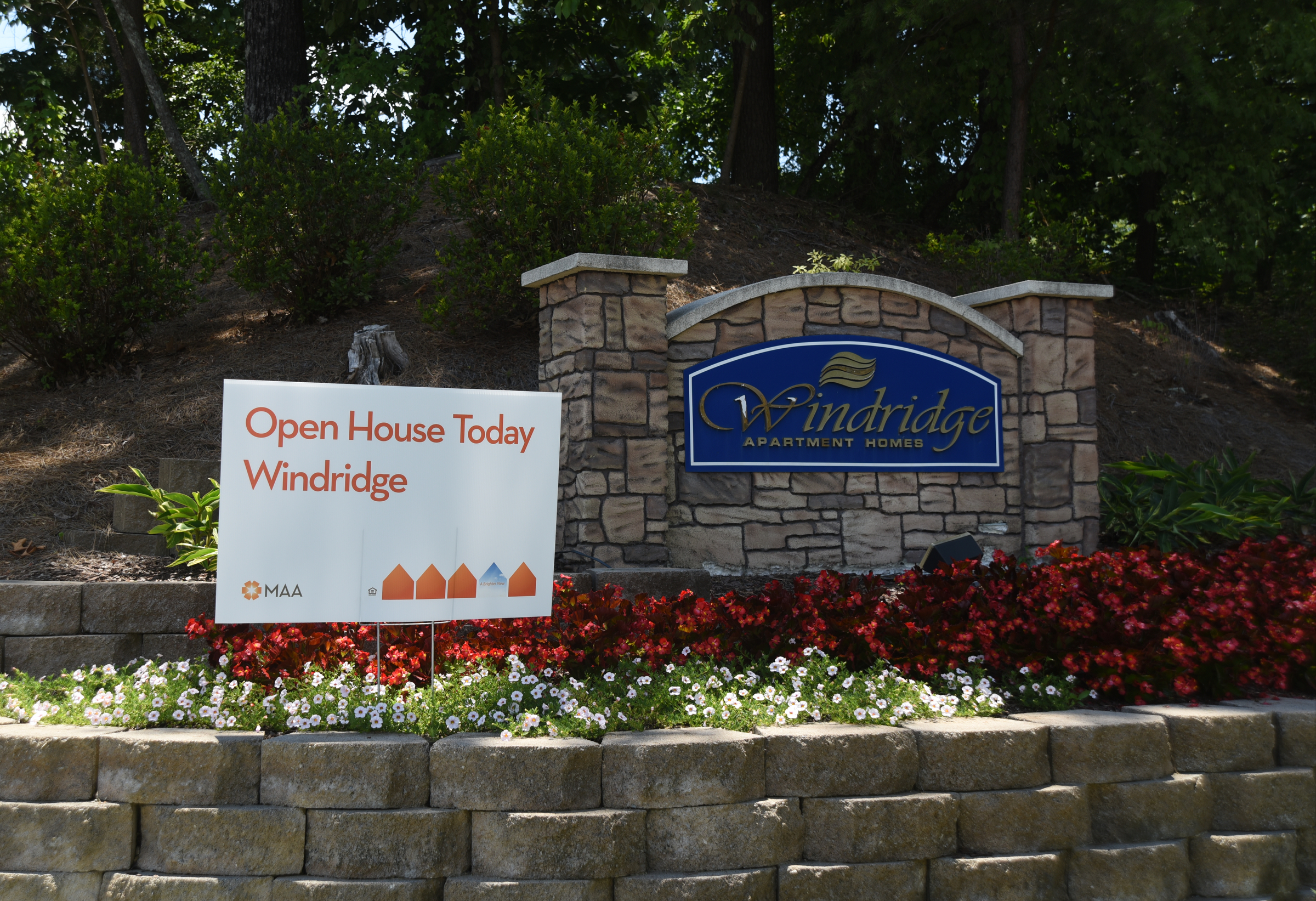 A sign advertises an open house at Windridge Apartments on Pineville Road Monday, June 20, 2016.