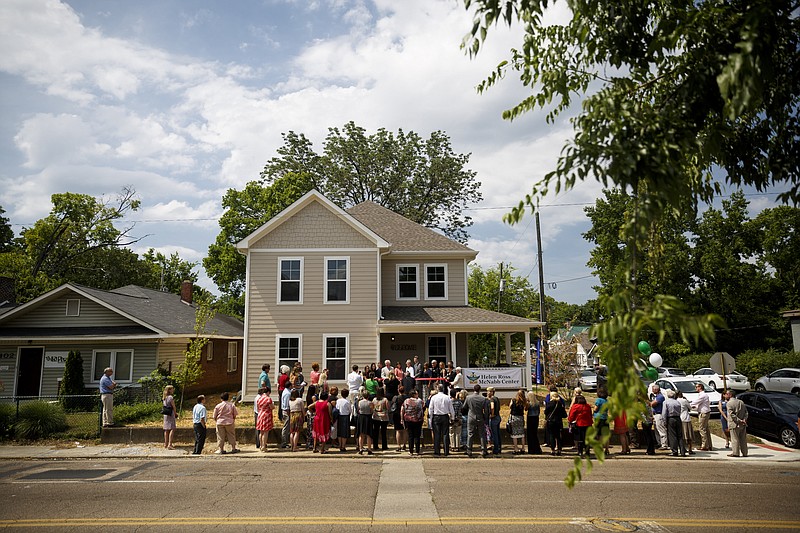 People gather at a ribbon-cutting for Bailey Home, a new residence facility for people with mental disabilities, on Tuesday, June 21, 2016, in Chattanooga. The co-ed facility set up by Helen Ross McNabb Center will house 10 residents.