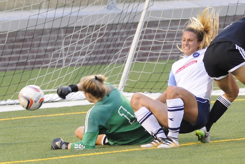 CFC's Ashley Harber grimaces as she falls during the third goal for Chattanooga. CFC defeated Knoxville 4-3, at Finley Stadium on Tuesday night.