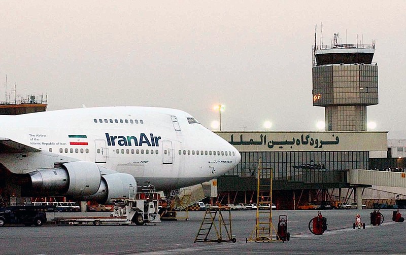 In this June 2003 file photo, a Boeing 747 of Iran's national airline is seen at Mehrabad International Airport in Tehran. Boeing Co. has confirmed signing an agreement with Iran Air "expressing the airline's intent" to buy its aircraft. In a statement Tuesday to The Associated Press, Boeing said it signed the agreement "under authorizations from the U.S. government following a determination that Iran had met its obligations under the nuclear accord reached last summer."