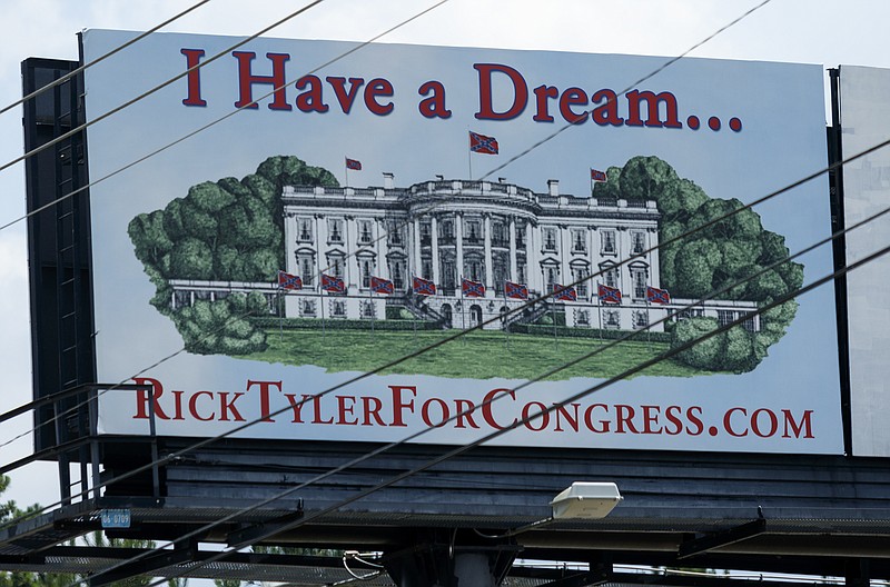A campaign sign for congressional candidate Rick Tyler which features confederate flags surrounding the white house is seen on Hwy. 64 on Wednesday, June 22, 2016, in Polk County, Tenn. Tyler also posted a sign which read "Make America White Again" on Hwy. 411 near Benton, Tenn., which has since been removed.