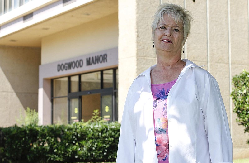 Roxann Larson stands outside of Dogwood Manor in this file photo.