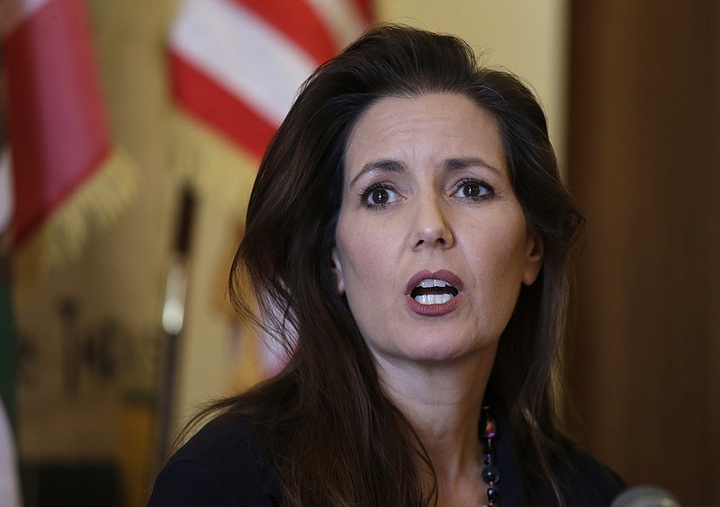 
              FILE - In this June 15, 2016, file photo Oakland Mayor Libby Schaaf answers questions during a news conference at City Hall in Oakland, Calif. Schaaf is a trained lawyer who left her legal career years ago for grassroots community service in Oakland that eventually led to her election as mayor of the long-troubled California city. Now, midway through her first term, she is facing the toughest trial of her political career with the scandal-ridden Oakland Police Department providing a seemingly daily dose of embarrassment for her and the city. (AP Photo/Eric Risberg, File)
            