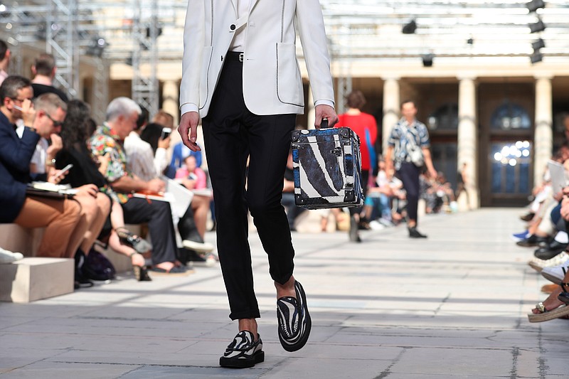 A model presents a creation for Louis Vuitton men's Spring-Summer
