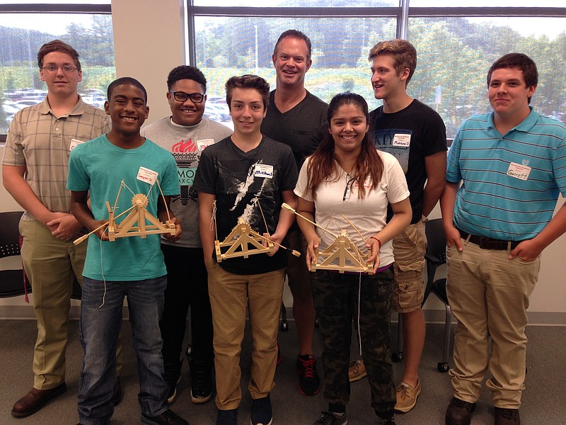 A group of Mechatronics Akademie students who participated in one of Chip Strickland's (teacher in the back middle) physics sessions this summer.