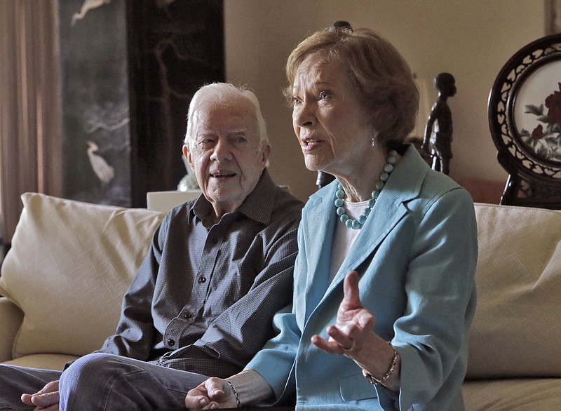 FILE -- This photo from 2016 shows Jimmy and Rosalynn Carter talk about their years together they close in on their 70th wedding anniversary.