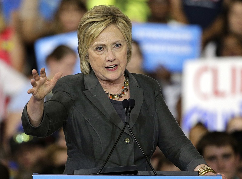 
              In this June 22, 2016, photo, Democratic presidential candidate Hillary Clinton gestures as she speaks during a rally in Raleigh, N.C. The nation’s framework for economic security and health care in retirement is financially unsustainable, but you wouldn’t know it from listening to the presidential candidates. Clinton has proposed expanding Social Security benefits for widows and family caregivers, as well as making upper-income earners pay more to support the program. She may have to go further, since liberals, including Vermont Sen. Bernie Sanders, are pressing for expanded benefits. President Barack Obama also wants to do more. (AP Photo/Chuck Burton)
            