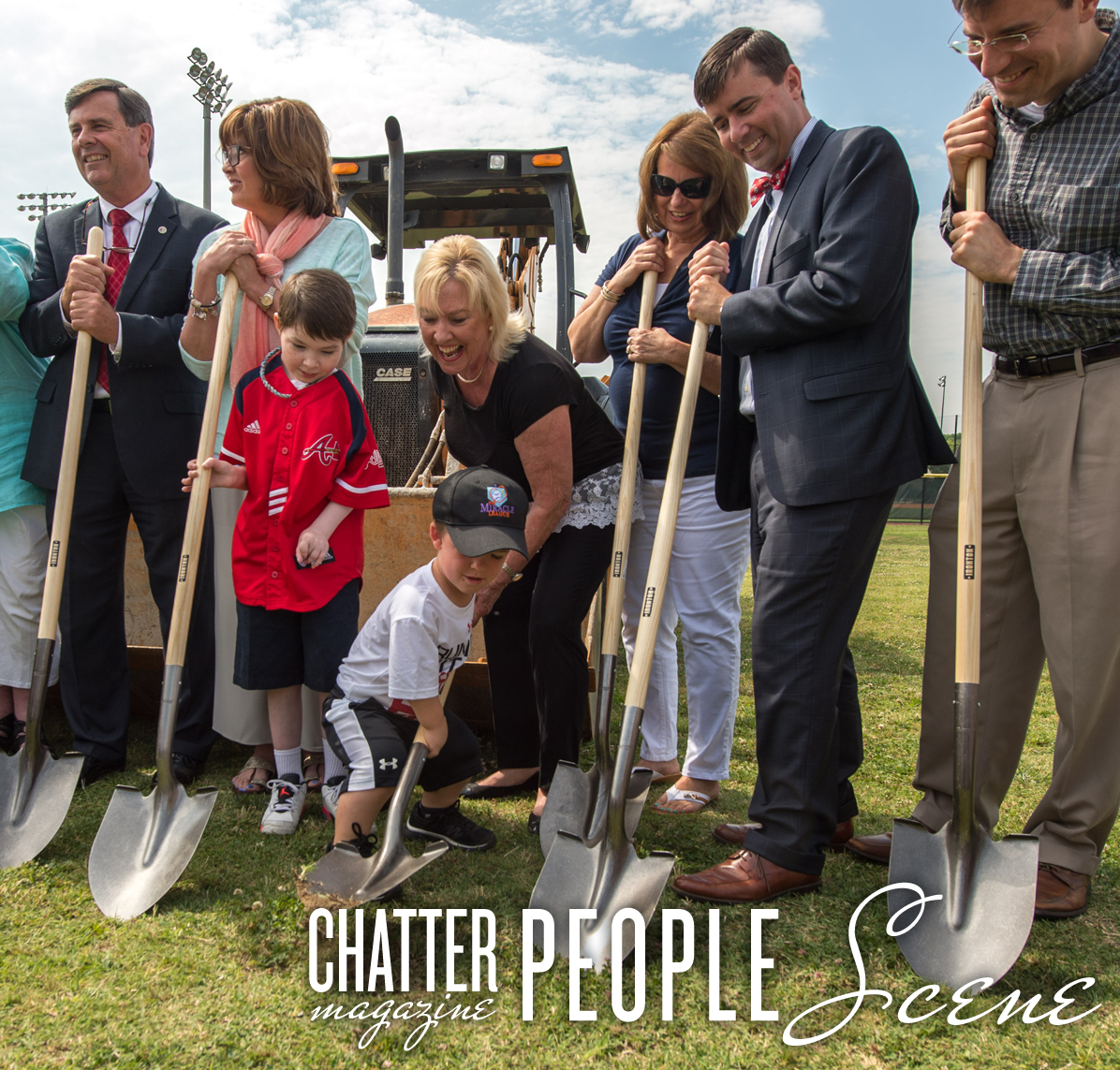 Jack Russell (center with black hat) helps out with the celebratory groundbreaking.