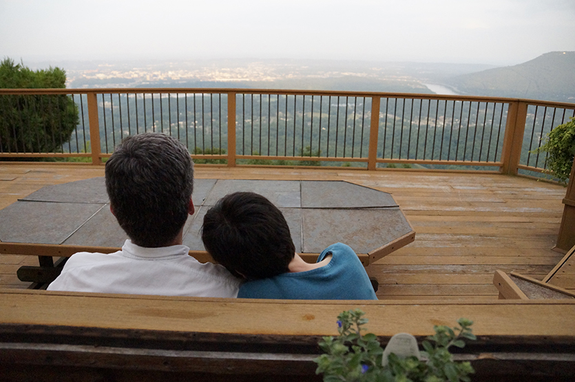 Michael and Lynne Herman watch the sun set in Lookout Valley from their back deck.
