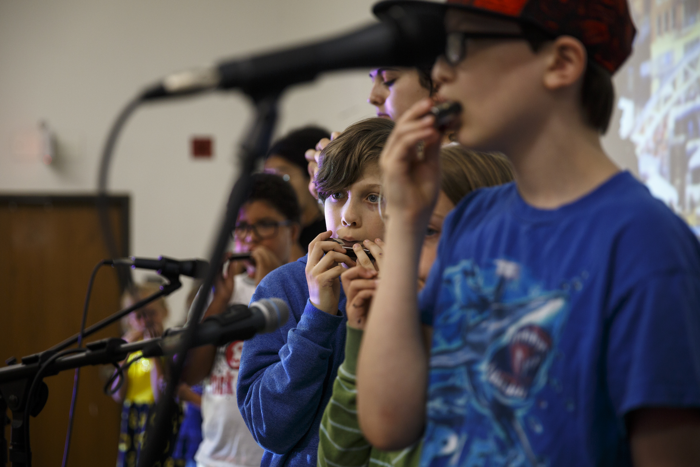Elias Spruill plays harmonica along with musician Mark LaVoei as LaVoei gives a lesson from Burlington, Vermont, via a digital link at the Chattanooga Public Library on Tuesday, June 21, 2016, in Chattanooga, Tenn. For Make Music Day, the library hosted interactive events that connected digitally to Burlington.
