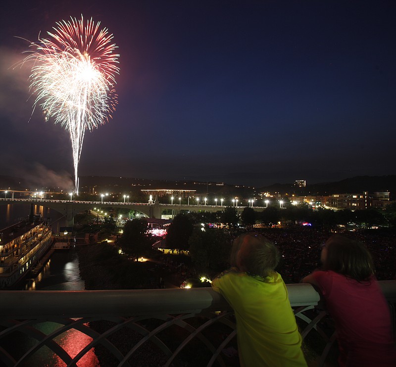 People watch a fireworks display from the Walnut Street Bridge and from Coolidge Park after Pops on the River.