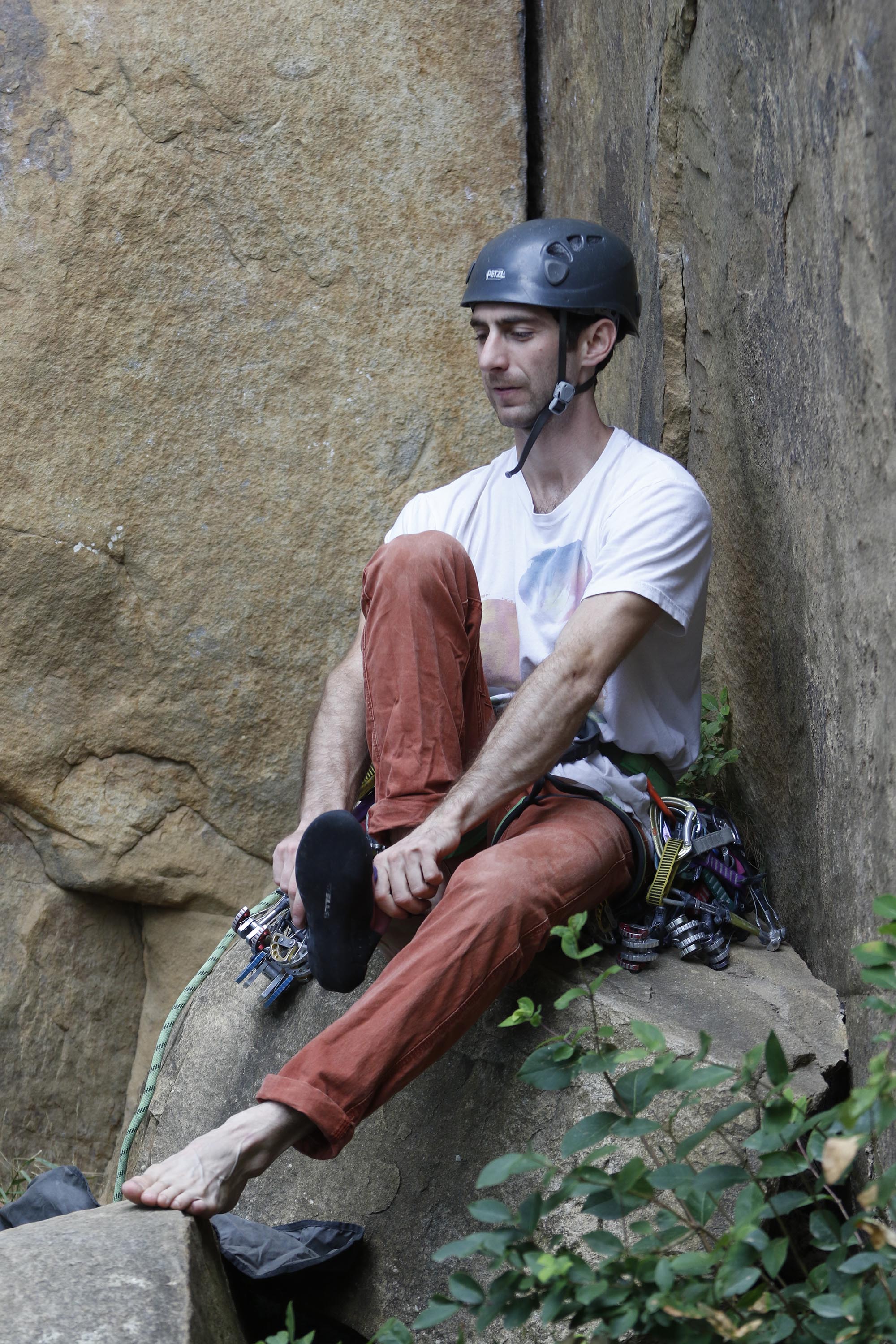 Staff Photo by Dan Henry / The Chattanooga Times Free Press- 6/23/16. Sam Latone prepares to teach Ana Jimenez (not pictured) how to set equipment on a simulated multi pitch climb at Sunset Rock atop Lookout Mountain on June 23, 2016. The pair used the training session in preparation for an upcoming trip to Colorado.