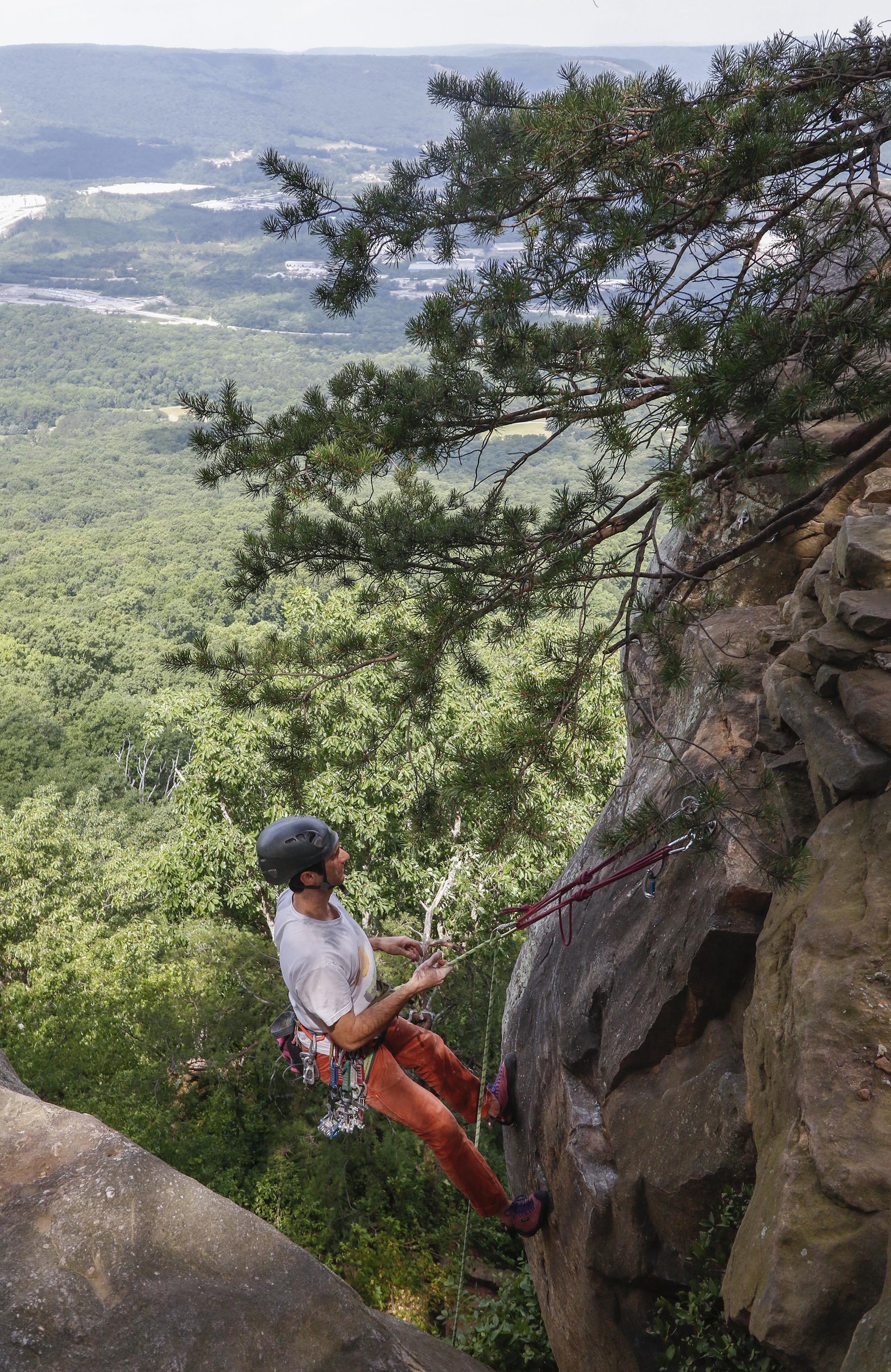 Staff Photo by Dan Henry / The Chattanooga Times Free Press- 6/23/16. Sam Latone and Ana Jimenez (not pictured) simulate a multi pitch climb at Sunset Rock atop Lookout Mountain on June 23, 2016 in preparation for an upcoming trip to Colorado.