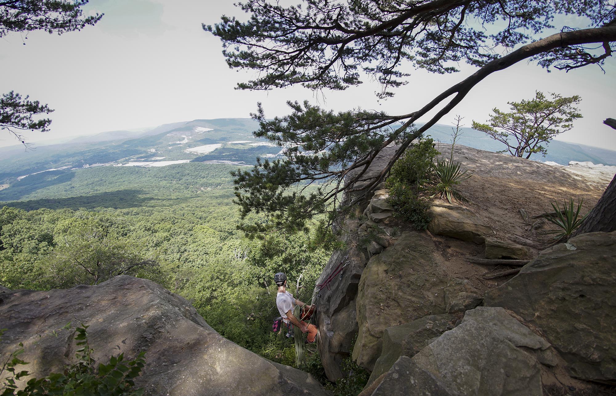 Staff Photo by Dan Henry / The Chattanooga Times Free Press- 6/23/16. Sam Latone and Ana Jimenez (not pictured) simulate a multi pitch climb at Sunset Rock atop Lookout Mountain on June 23, 2016 in preparation for an upcoming trip to Colorado.