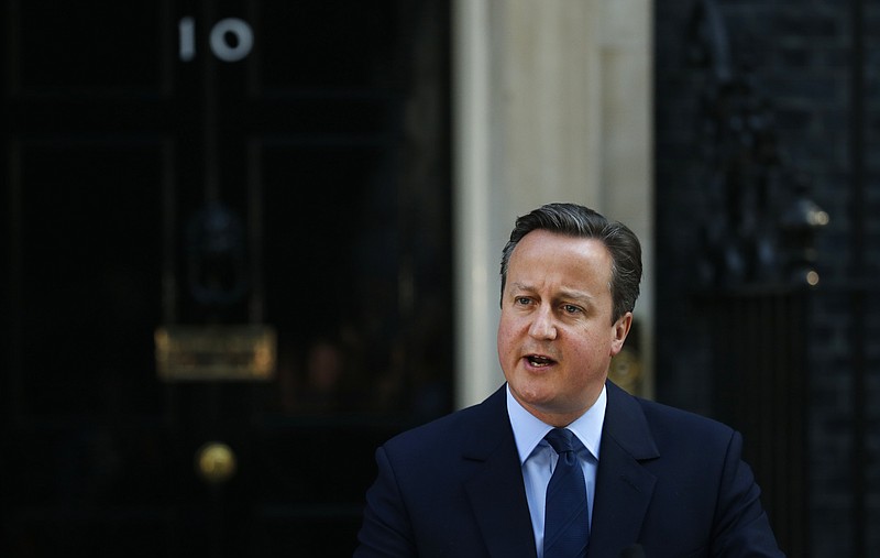 
              Britain's Prime Minister David Cameron speaks to the media in front of 10 Downing street, as he goes on to announce his resignation following the result of the EU referendum, in which the Britain voted to leave the EU, in London, Friday, June, 24, 2016. (AP Photo/Alastair Grant)
            