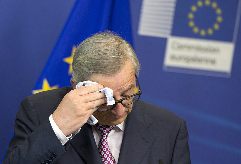 
              European Commission President Jean-Claude Juncker wipes his brow before speaking during a media conference at EU headquarters in Brussels on Wednesday, June 22, 2016. Voters in the United Kingdom are taking part in a referendum on Thursday that will decide whether Britain remains part of the European Union or leaves the 28-nation bloc. (AP Photo/Virginia Mayo)
            