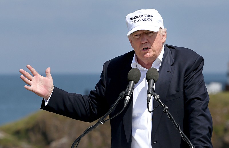 
              The presumptive Republican presidential nominee Donald Trump makes a speech at his revamped Trump Turnberry golf course in Turnberry Scotland Friday June 24, 2016. Trump, in Scotland the day after the United Kingdom voted to leave the European Union, saluted the decision, saying the nation's citizens "took back their country."   (Jane Barlow/PA via AP) UNITED KINGDOM OUT  
            