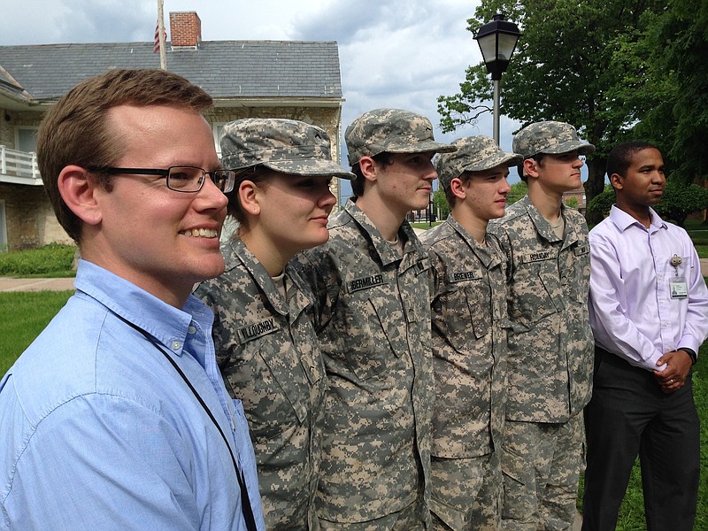 
              In this May 23, 2016 photo, Maryland School for the Deaf government and history teacher Keith Nolan, left, stands at attention with school Cadet Corps members, left to right, Jennida Willoughby, Maverick Obermiller, Blake Brewer and Kiser Holliday, and school audiologist David Alexander in Frederick, Maryland. Nolan wants the Defense Department to allow deaf people to enter the armed services. (AP Photo/David Dishneau)
            
