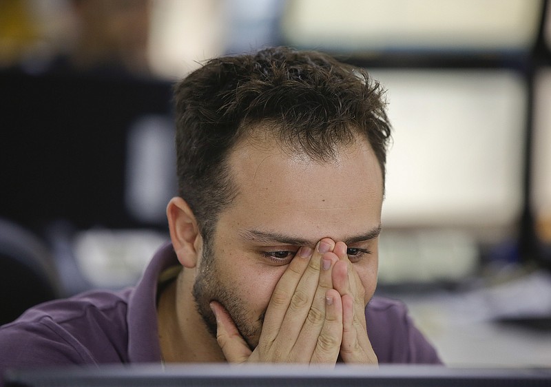 
              A broker watches his screens at a brokerage firm in Sao Paulo, Brazil, Friday, June 24, 2016. Sao Paulo's stock exchange was falling at midday more than 3 percent due to result of the referendum aimed at revoking Britain's membership in the EU. Brazil's central bank said on Friday that the country has solid foundations to face the United Kingdom's decision to leave the European Union, with enough foreign reserves to handle possible cash outflows. (AP Photo/Andre Penner)
            