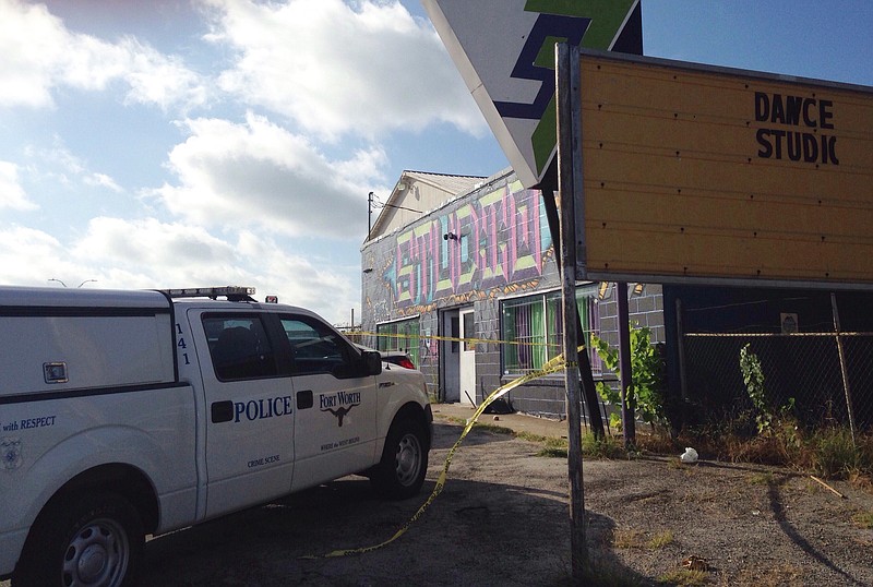 
              Police respond to the scene of a shooting at a Fort Worth, Texas dance studio early Saturday, June 25, 2016.  Fort Worth police spokesman Daniel Segura  said homicide detectives were investigating at the studio, which sits on a state highway near a police station and multiple businesses and restaurants. (AP Photo/Emily Schmall)
            