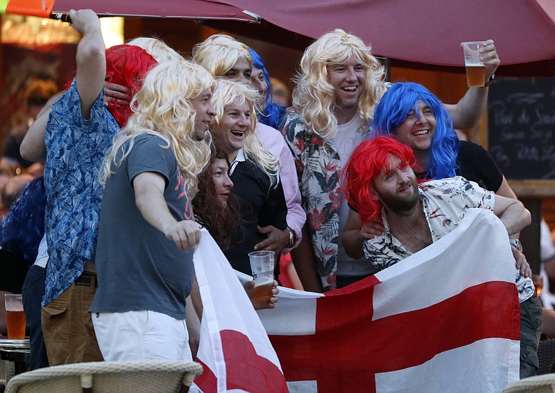 
              England soccer fans pose for a photograph in Nice, France, Sunday, June 26, 2016, a day ahead of the Euro 2016 round of 16 soccer match between England and Iceland. (AP Photo/Darko Bandic)
            