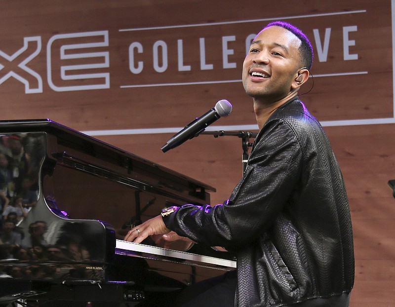 
              FILE - In this March 17, 2016, file photo, John Legend performs during the South by Southwest Music Festival in Austin, Texas. The Springfield School District in Springfield, Ohio is nearing completion on its newly renovated John Legend Theater, and officials are trying to determine how it will be shared with the community. The $2.5 million project is expected to be completed by September. Legend donated $500,000 for the project. The Oscar- and Grammy-winning artist is a graduate of the Springfield district. (Photo by Jack Plunkett/Invision/AP, File)
            