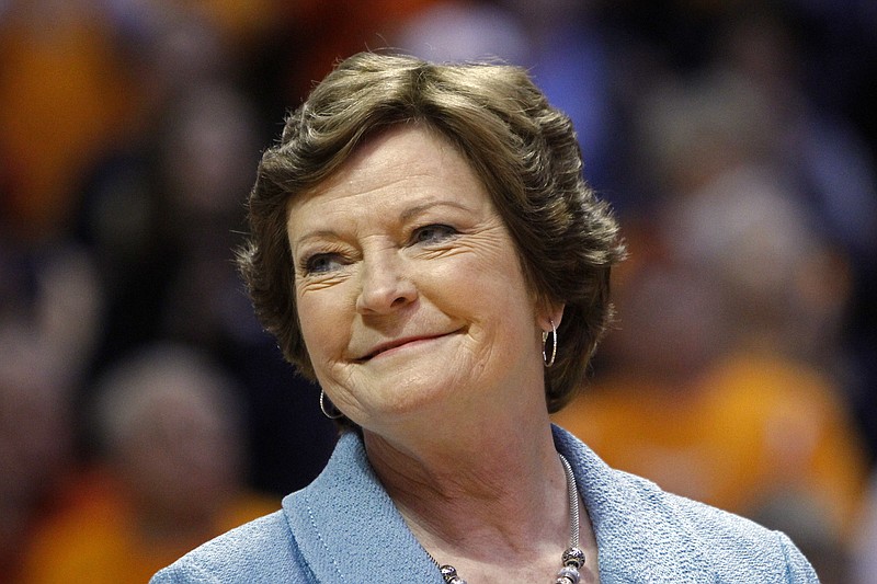 
              FILE - In this Jan. 28, 2013, file photo, former Tennessee women's basketball coach Pat Summitt smiles as a banner is raised in her honor before the team's NCAA college basketball game against Notre Dame in Knoxville, Tenn. Amid reports of Summitt’s failing health as her Alzheimer’s disease progresses, her family issued a statement Sunday, June 26, 2016, asking for prayers and saying that the former Tennessee women’s basketball coach is surrounded by the people who mean the most to her. (AP Photo/Wade Payne, File)
            