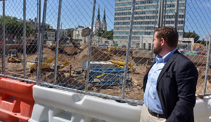 Phillip Ashlock looks at construction of a new hotel just north of Drayton Towers on June 15, 2016 in Savannah, Ga. Ashlock is circulating a petition to get the city to adopt an archaeological ordinance to prevent archaeological resources from potentially being lost and destroyed.