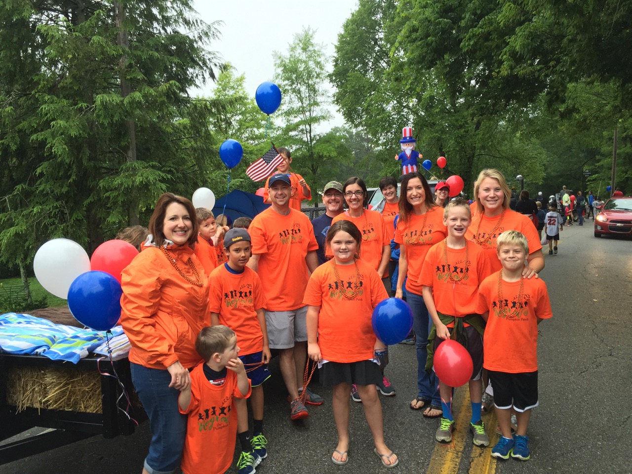 The group raising funds to rebuild the Pumpkin Patch playground gets ready to walk in last year's Fourth of July parade.