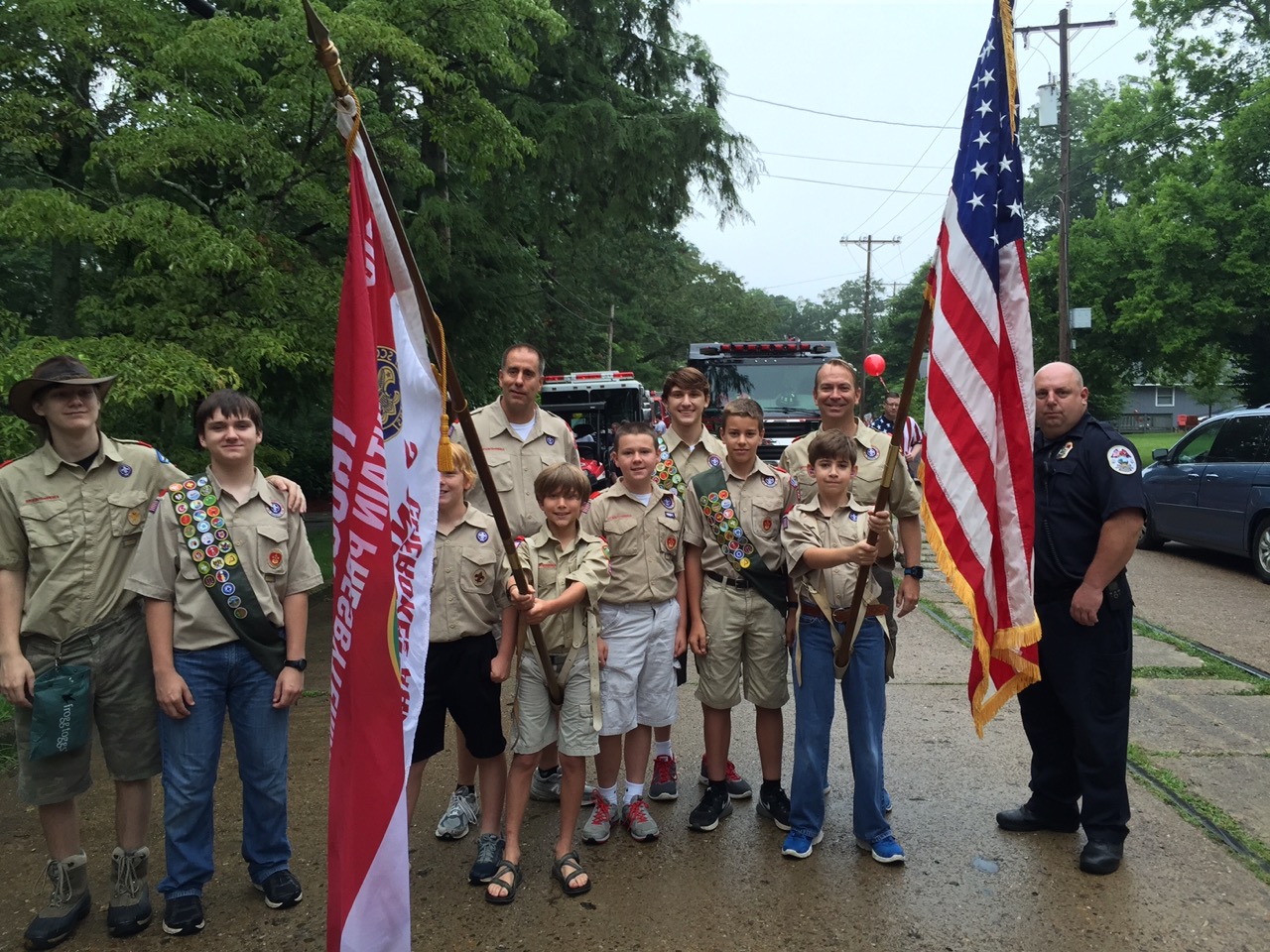 The Boy Scouts get last-minute instructions before the horn sounds to signal the beginning of last year's Fourth of July parade.
