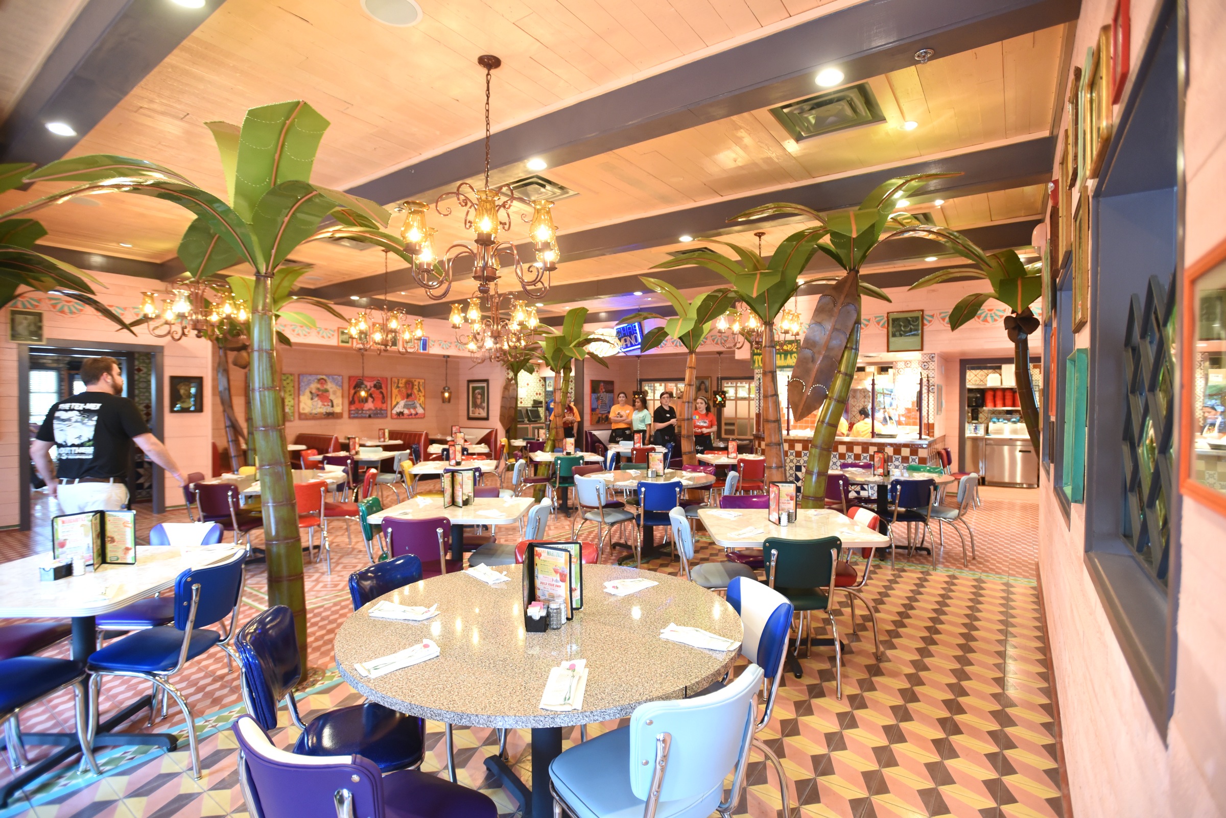 The main dining area features palm trees Monday, June 27, 2016 at Chuy's on Gunbarrel Road.