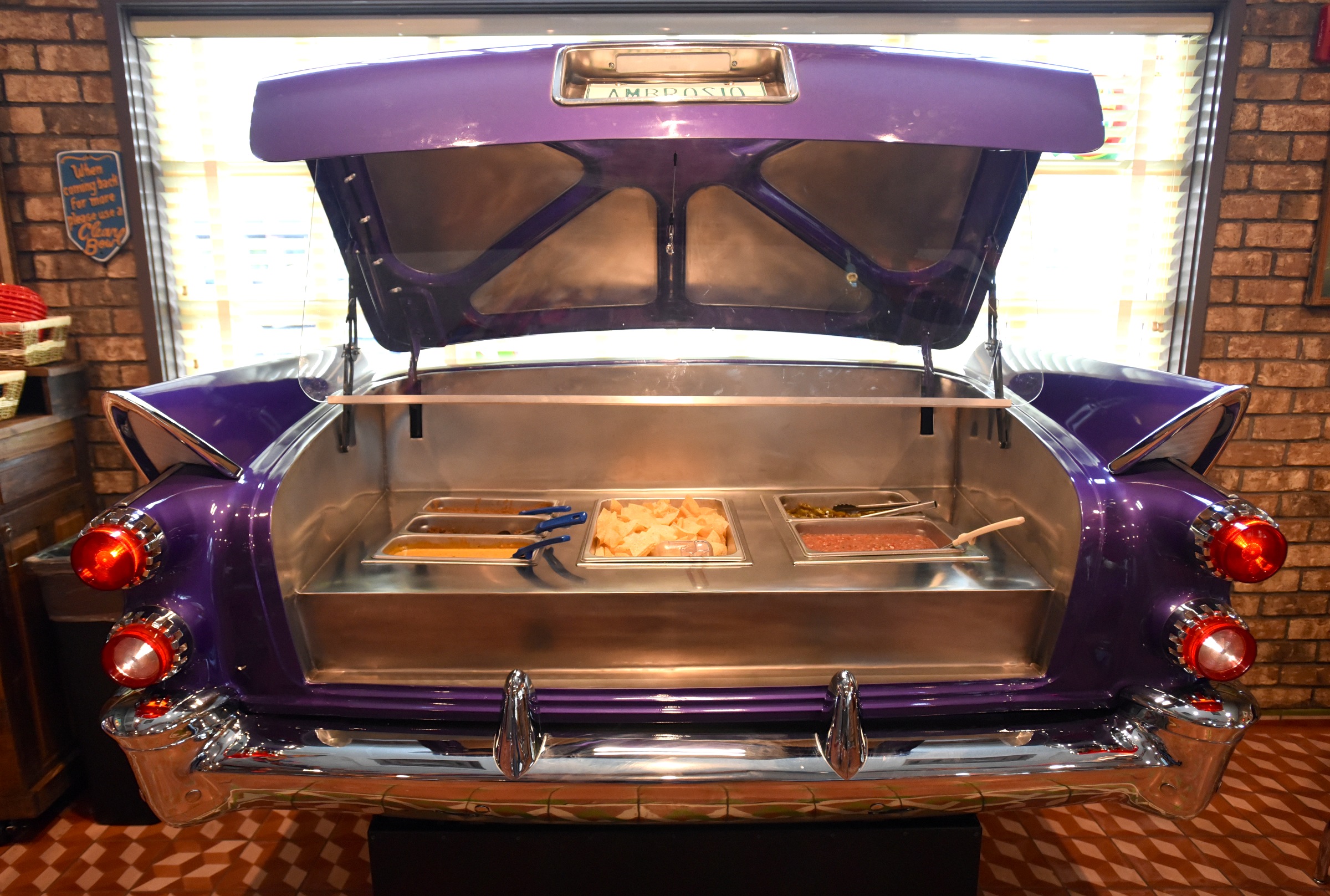 A nacho bar is in the trunk of a car Monday, June 27, 2016 at Chuy's on Gunbarrel Road.