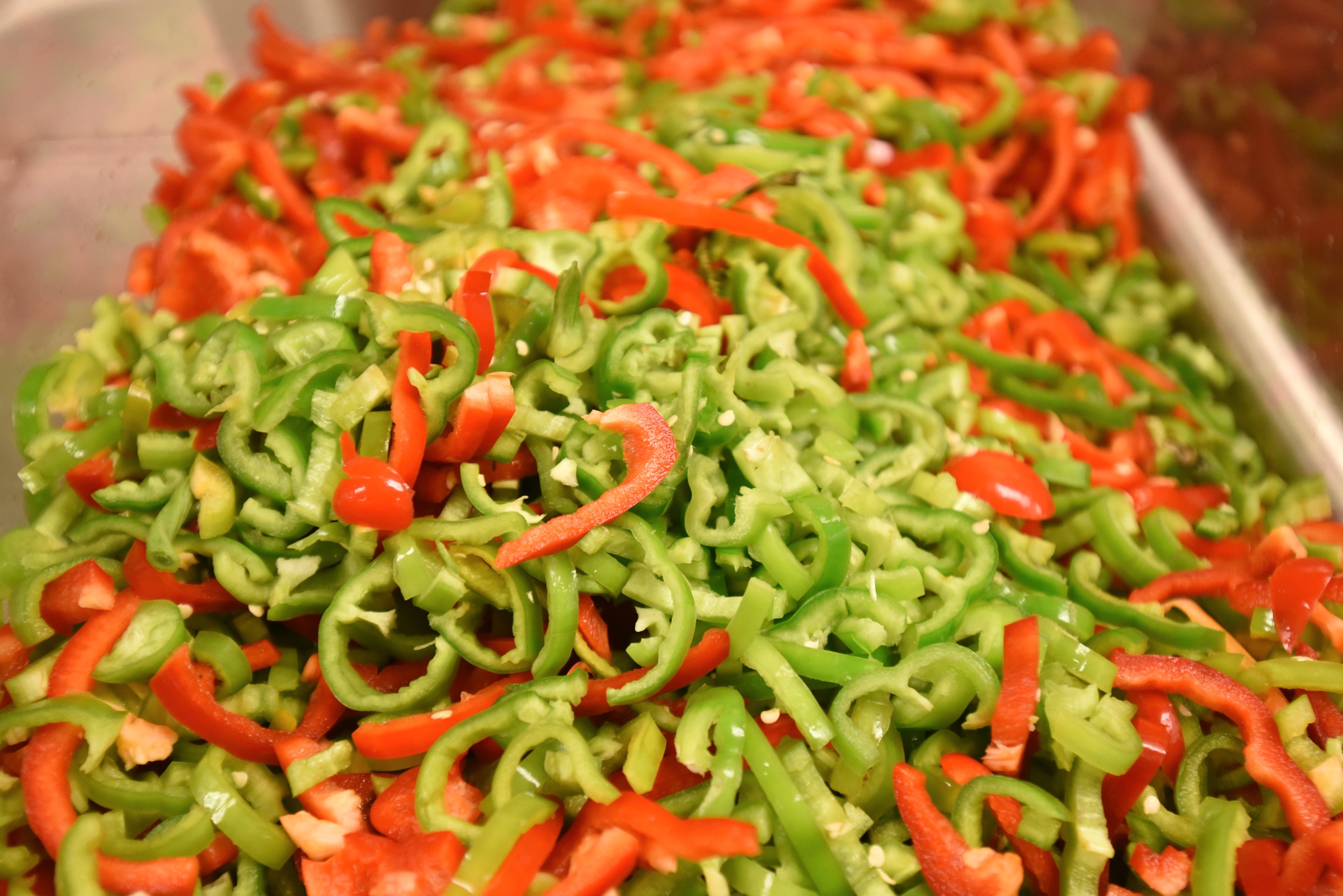 Anaheim and serrano peppers fill a pan Monday, June 27, 2016 at Chuy's on Gunbarrel Road.