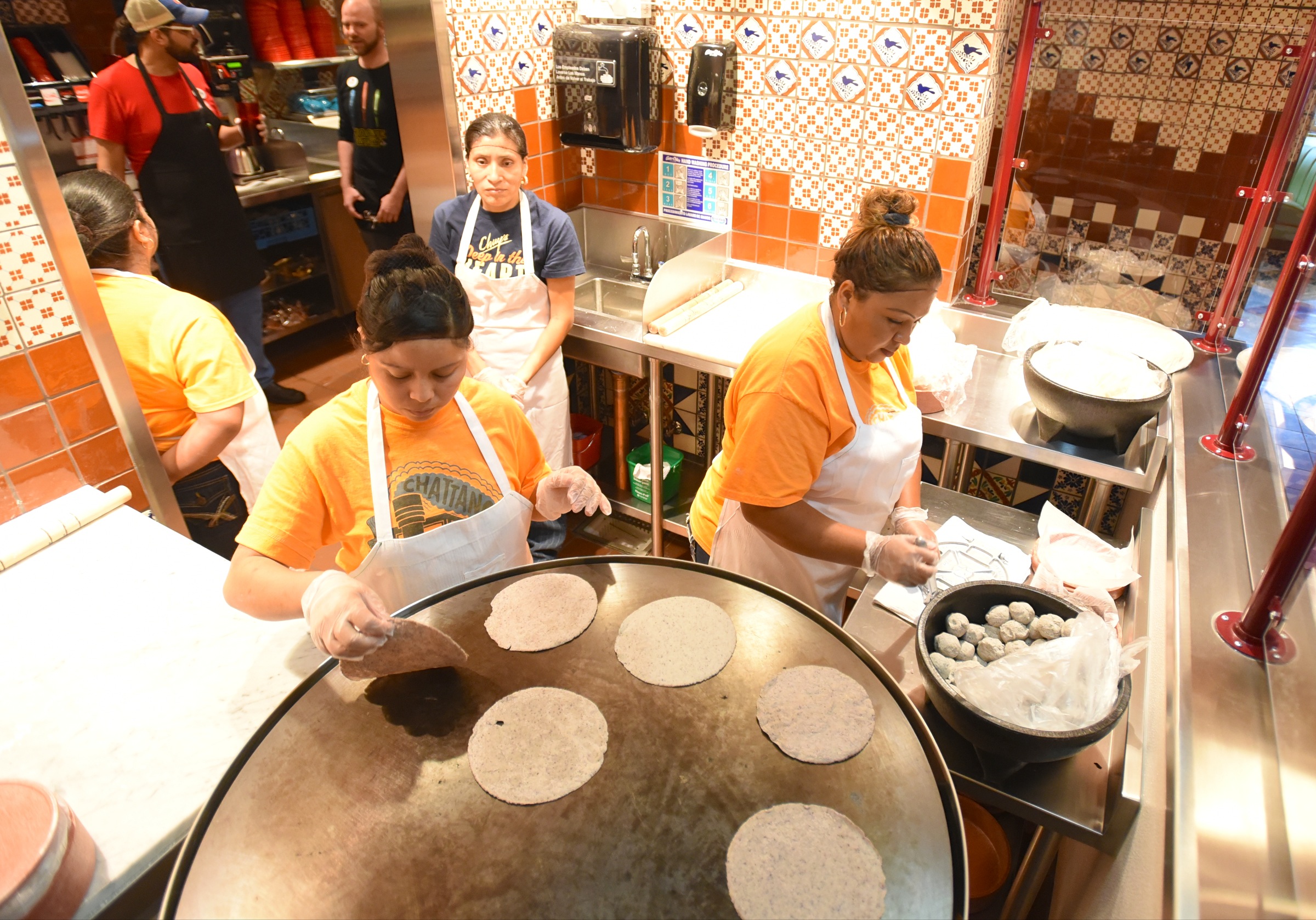 Zuleik Crespo Ayoso, Rosalia Velasquez and Maria Reyes, from left, work Monday, June 27, 2016 at Chuy's on Gunbarrel Road.