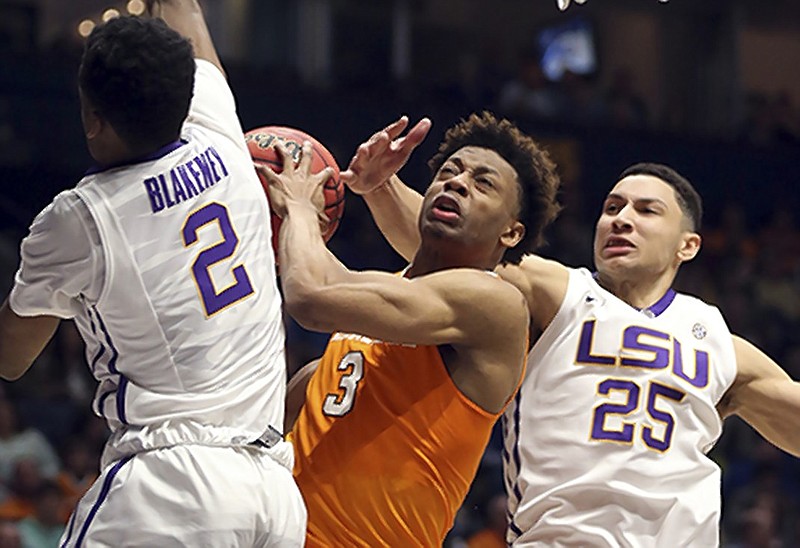 Tennessee's Robert Hubbs III (3) tries to drive against LSU's Ben Simmons (25) and Antonio Blakeney (2) during the second half of an NCAA college basketball game in the Southeastern Conference tournament in Nashville, Tenn., Friday, March 11, 2016. (AP Photo/John Bazemore)