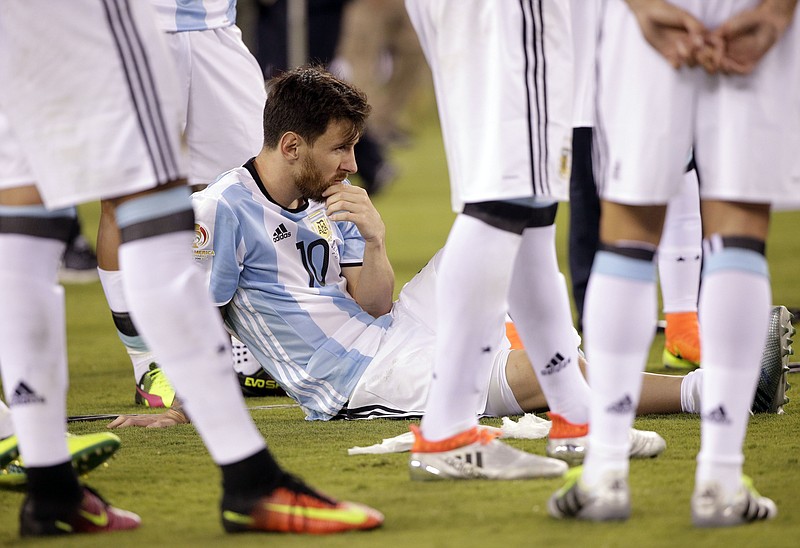 
              Argentina's Lionel Messi waits for trophy presentations after the Copa America Centenario championship soccer match, Sunday, June 26, 2016, in East Rutherford, N.J. Chile defeated Argentina 4-2 in penalty kicks to win the championship. (AP Photo/Julie Jacobson)
            