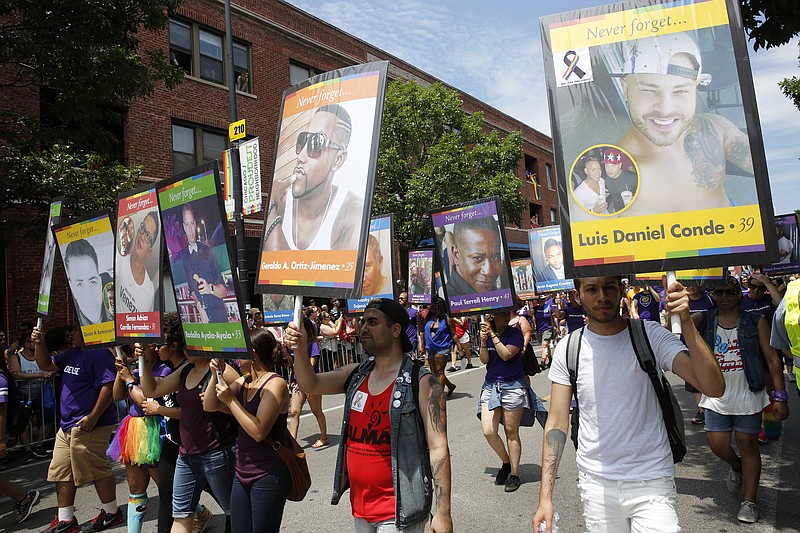 Portraits of the Orlando nightclub shooting victims are carried at the beginning of the 47th Annual Chicago Pride parade on Sunday, June 26, 2016 on Halsted Street in Chicago. 