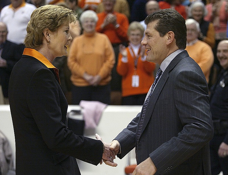 In this Jan. 7, 2006, file photo, Tennessee coach Pat Summitt, left, shakes hand with Connecticut coach Geno Auriemma before a women's college basketball game in Knoxville, Tenn. The update on Pat Summitt's health caught Geno Auriemma by surprise. It's simply the news nobody wanted to hear, especially her former rival who built UConn trying to model off her success coaching Tennessee.