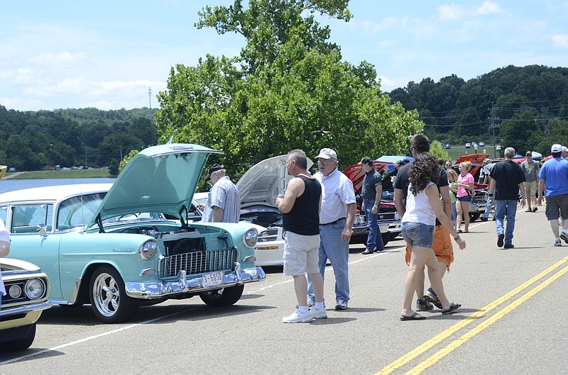 People gather to look at vintage vehicles at the Fourth of July festivities at North Park across from Soddy Lake Friday in Soddy-Daisy in 2014.
