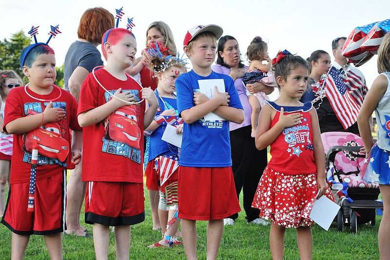 Kids dressed in their red, white and blue apparel lead the Pledge of Allegiance at a previous Patriotism at the Post in Fort Oglethorpe. This year's celebration takes place Sunday, July 3.