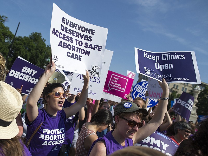 Pro-abortion rights demonstrators react to news of the U.S. Supreme Court's decision on abortion, outside the court in Washington, on Monday.