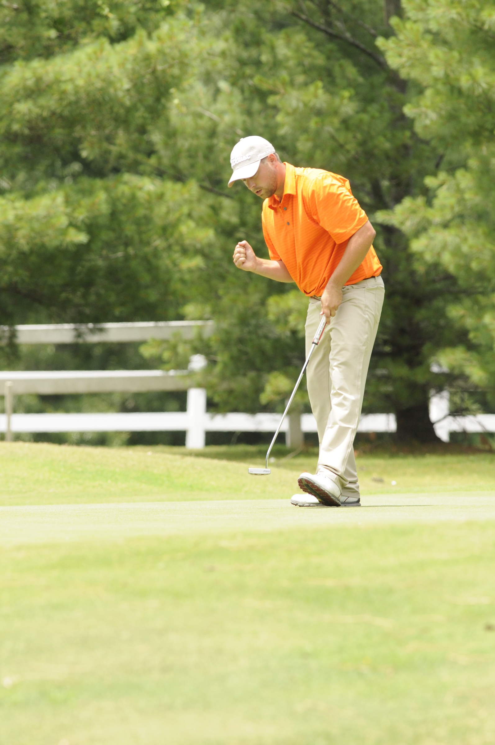 Casey Flenniken pumps his fist after making par at No. 18, to complete his 6-under-par tournament win at Creeks Bend Golf Club in Hixson on Tuesday.