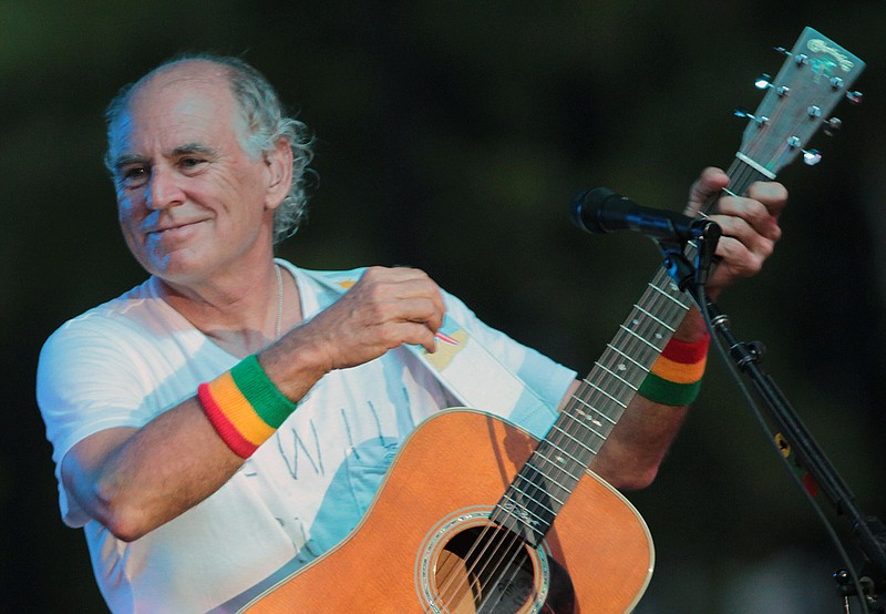 
              FILE - In this June 30, 2010, file photo, Jimmy Buffett performs at his sister's restaurant in Gulf Shores, Ala. The Jimmy Buffett musical making its world premiere in 2017 in California has a new name and a Tony Award-winning creative support team. The musical is now titled “Escape to Margaritaville." (AP Photo/Dave Martin, File)
            