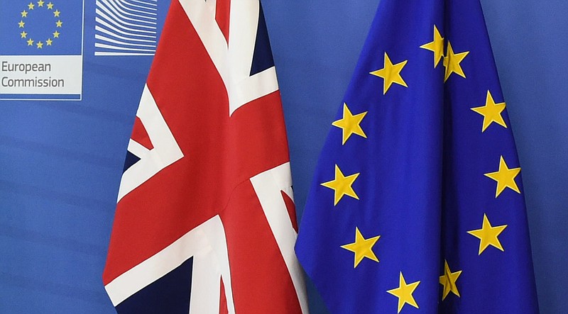 
              FILE -  This is Tuesday, Feb. 16, 2016 file photo of  the EU, right, and the British flags as they are placed next to each other at EU headquarters in Brussels. Nearly 1,000 British nationals who work for the European Union's executive have been assured their jobs are safe. ?  (AP Photo/Geert Vanden Wijngaert , File )
            