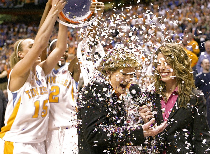 In this Feb. 5, 2009, file photo, Tennessee coach Pat Summitt has confetti dumped on her by players Alicia Manning (15) and Alex Fuller (2) after the Lady Vols defeated Georgia 73-43 in an NCAA college basketball game in Knoxville, Tenn., earning Summitt her 1,000th career coaching victory.  (AP Photo/Wade Payne, File)