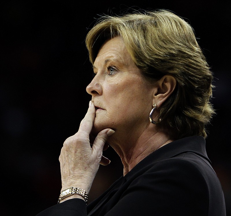 In this Nov. 12, 2010, file photo, Tennessee coach Pat Summitt watches her team against Louisville in a NCAA college basketball game in Louisville, Ky. Summitt, the winningest coach in Division I college basketball history who uplifted the women's game from obscurity to national prominence during her career at Tennessee, died Tuesday morning, June 28, 2016. She was 64.