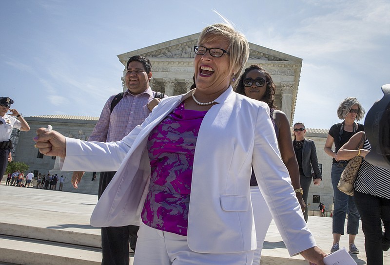 Amy Hagstrom Miller, founder of Whole Woman's Health, a Texas women's health clinic that provides abortions, rejoices as she leaves the Supreme Court in Washington, Monday, June 27, 2016, as the justices struck down the strict Texas anti-abortion restriction law known as HB2. The justices voted 5-3 in favor of Texas clinics that had argued the regulations were a thinly veiled attempt to make it harder for women to get an abortion in the nation's second-most populous state. The case is Whole Woman's Health v. Hellerstedt.