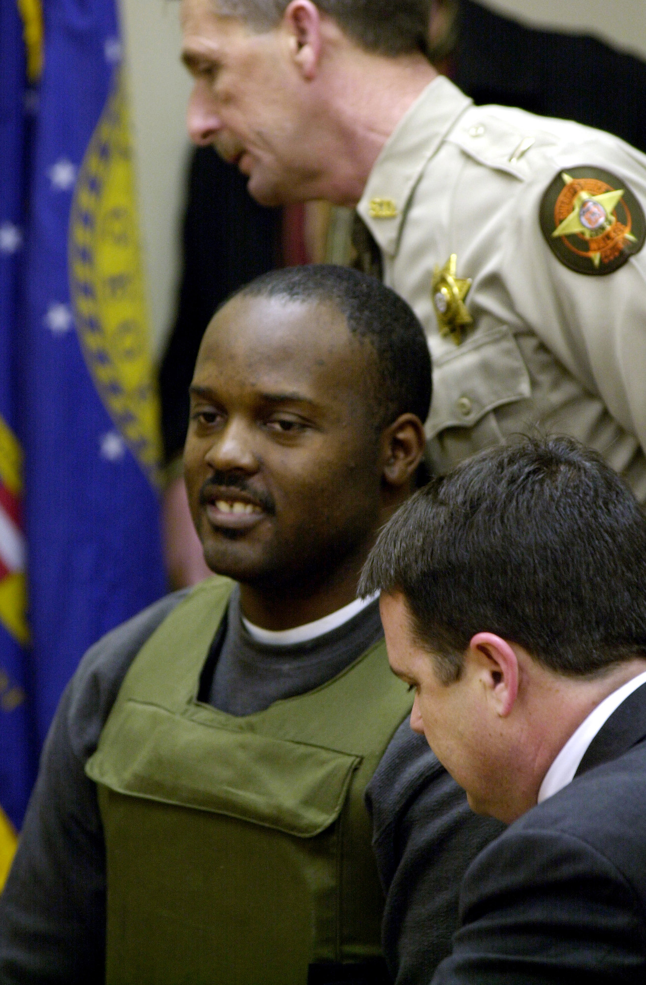Ray Brent Marsh sits between his attorney Ken Poston, right, and a deputy at the end of his bond hearing in the Walker County Magistrate Court in Lafayette, Ga., Friday, Feb. 22, 2002. Judge Day took the bond under advisement and said he would issue a written order in several days. Marsh, the owner of the Tri-State Crematory in Noble, Ga., faces 16 counts of theft by deception for allegedly discarding hundreds of bodies instead of cremating them. (AP Photo/Ric Feld, Pool)