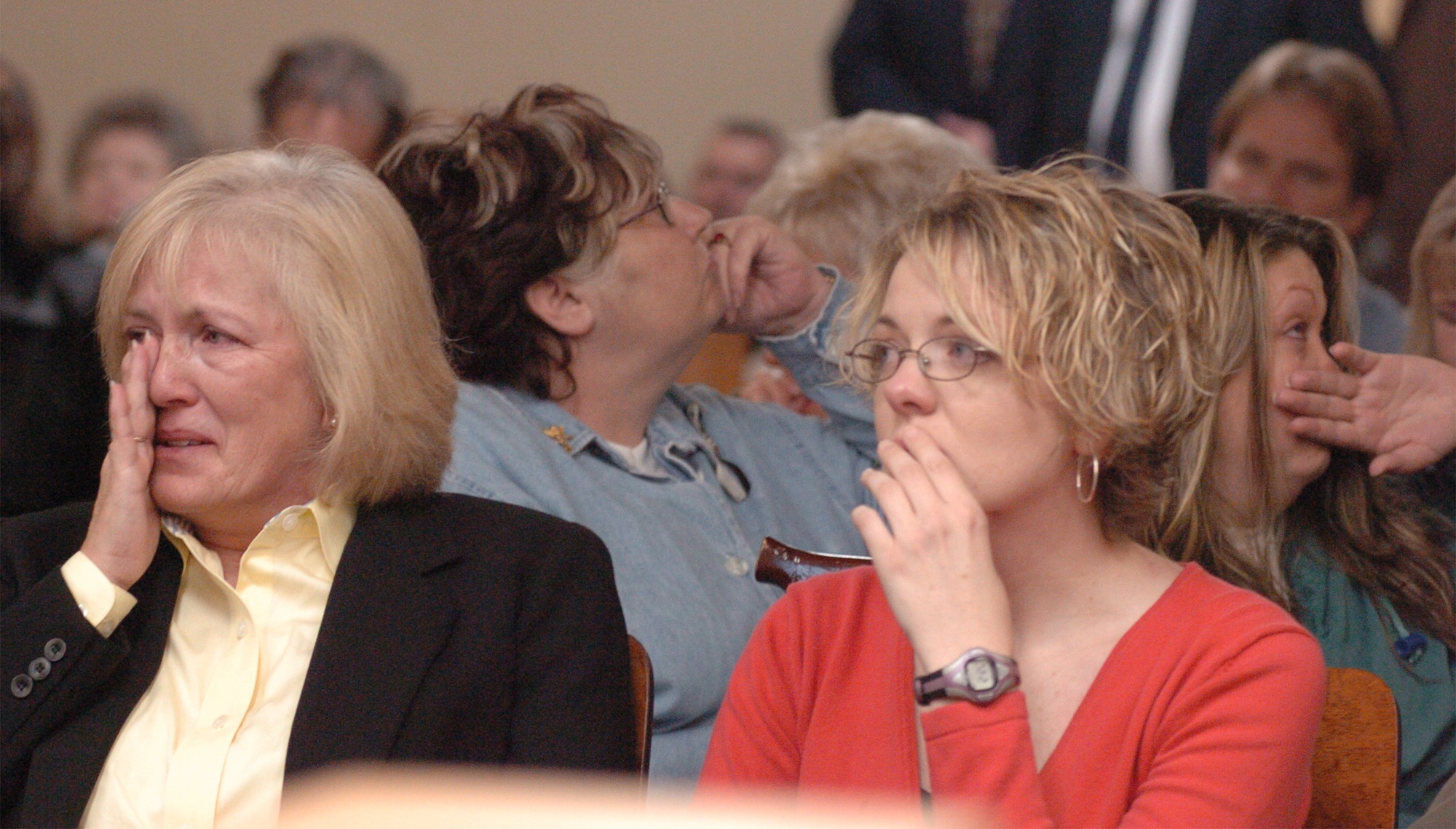 Teri Crawford, left, and her daughter Jennifer Curtis cry in the front row while Leatha Shropshire, second row left, and daughter Veronica Lively turn their backs as Brent Marsh reads a prepared statement to the courtroom Friday afternoon in the Walker County Judiciary Annex in LaFayette Georgia. Mr. Marsh, former operator of the Tri-State Crematory, pled guilty to all charges but the judge is waiting to accept the plea until he can hear from all people involved.